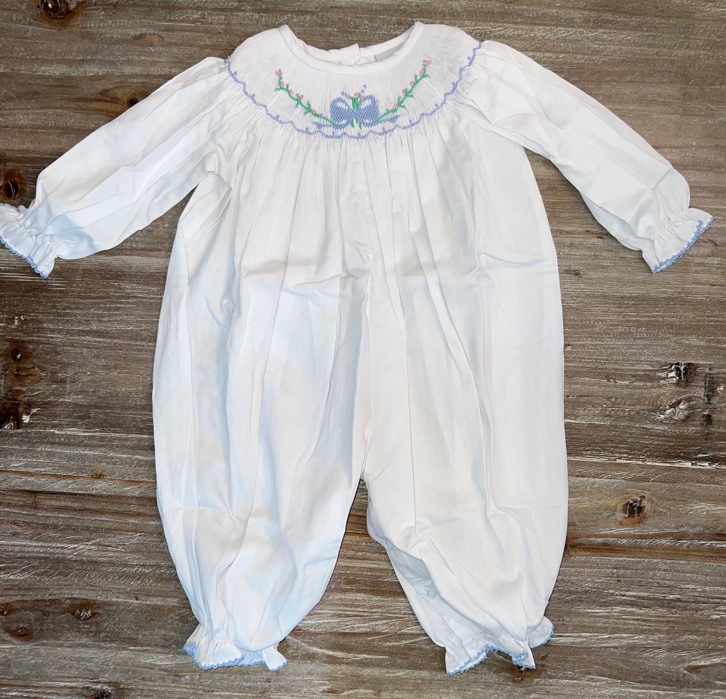 White with Blue Bow Smocked Girls Bishop Bubble Romper